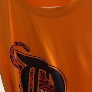 Bright Orange Graphic Tee with Large Black and Red Print